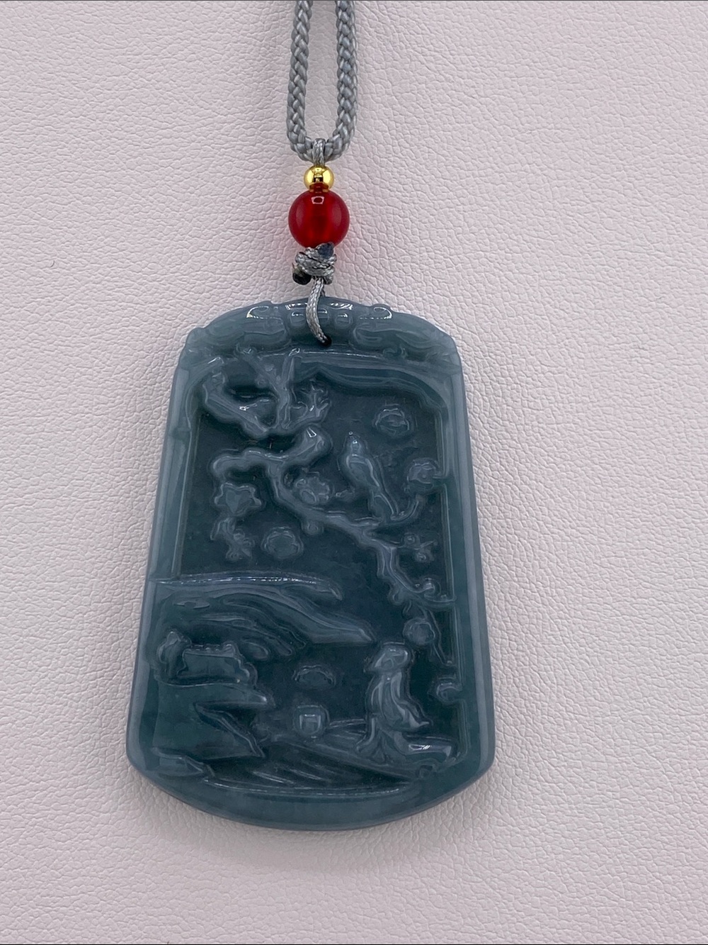 Carved Dark Teal Jade Pendant Necklace with Red Accent Bead